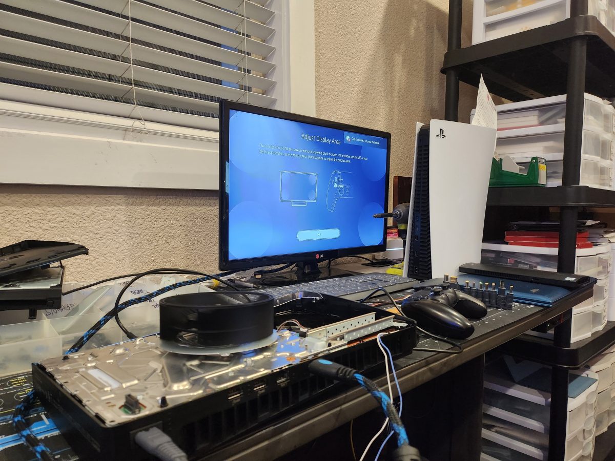 PlayStation 5 connected to a monitor for HDMI output testing after repair at Device Hero in Manor, TX