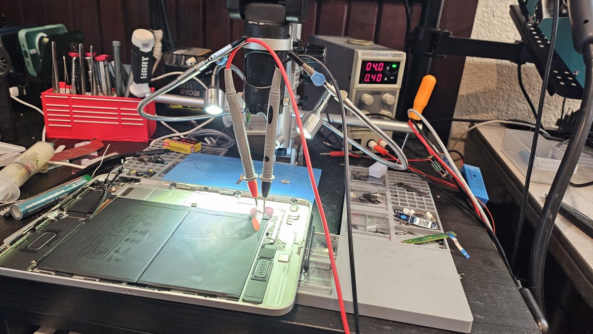 Board-level micro-soldering repair on a phone logic board at Device Hero, serving East Austin