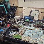 Repair bench with laptops, phones and an iMac at Device Hero, serving Round Rock, TX
