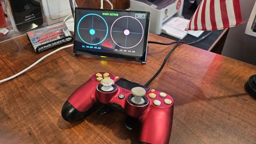 Game controller hooked up to a stick drift tester for calibration at Device Hero in Manor, TX