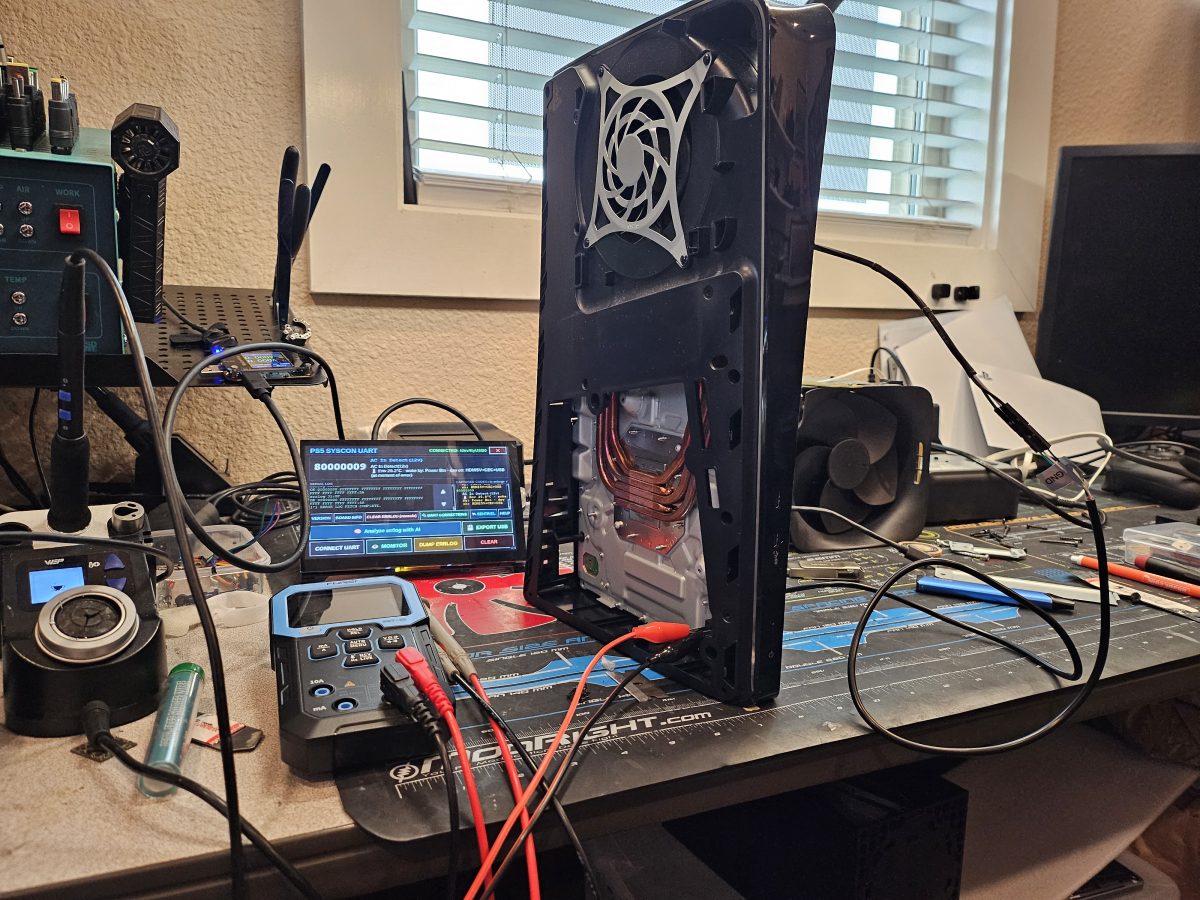 PlayStation 5 hooked up to bench power and diagnostic gear during an HDMI port repair in Manor, TX