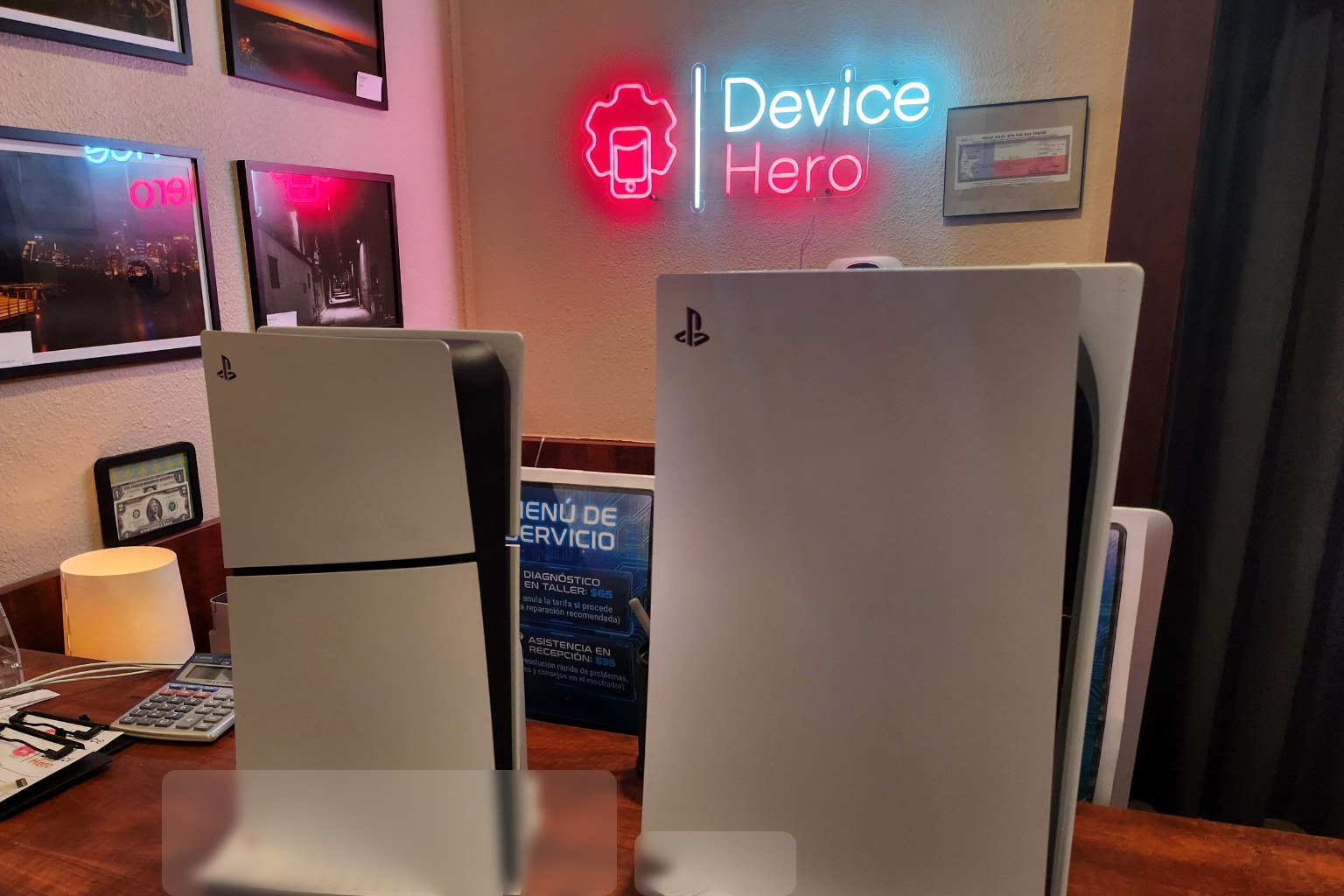 Two PlayStation 5 consoles on the counter at Device Hero in Manor, TX