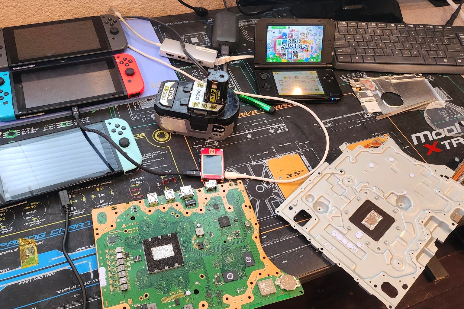 Nintendo Switch and retro console repairs in progress on the Device Hero workbench