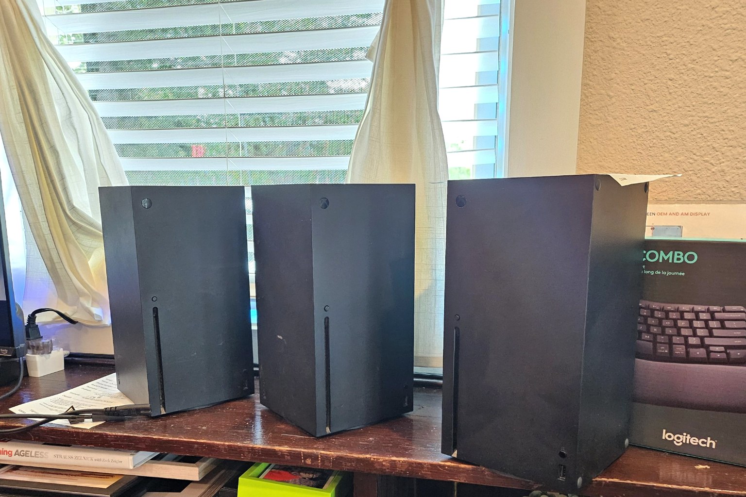 Three Xbox Series X consoles lined up for repair at Device Hero