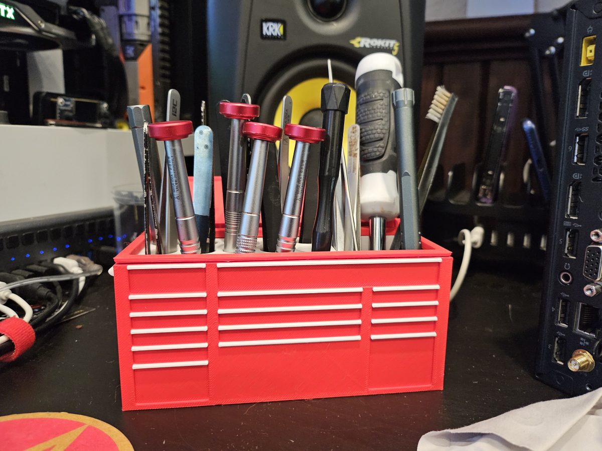 Precision screwdrivers and pry tools on the repair bench